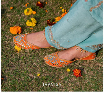 Mirror Magic: Handcrafted Orange Juttis