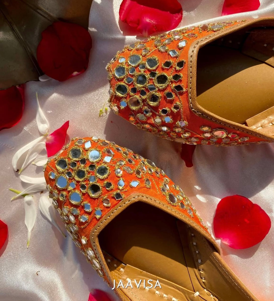 Mirror Magic: Handcrafted Orange Juttis